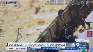 Video: Border agents, migrants clash at border wall