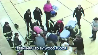 Girl playing basketball impaled by Middleton fieldhouse court