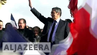 France election: Fillon vows to fight on at Paris rally