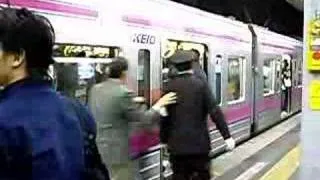 Sardine-packed train in Shinjuku during rush hour