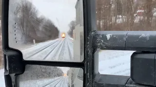 CSX train passes track inspector in hi-rail truck