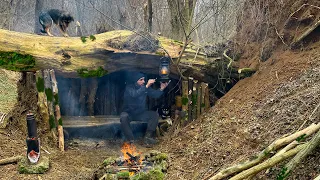 Building a secret survival shelter under a fallen tree | Bushcraft Skills