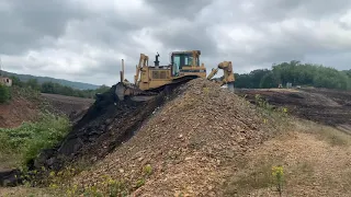 Cat D8R backfilling mine pit