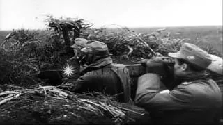 German forces,attempting to hold the line, fire artillery at at advancing Soviets...HD Stock Footage