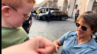 Marley gets his Top Gun Maverick shirt signed by Tom Cruise while in Rome