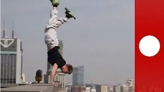 Head for heights: extreme handstand on top of Shanghai skyscraper