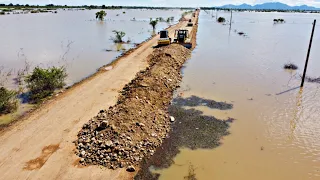 Wonderful. Process of Repairing Roads Damaged By floods By SHANTUI Bulldozer Push Stone into water