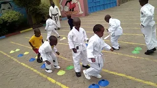 Tomylee -  Kenya Karate Coach with Small kids at Josnah primary school