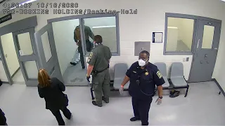 Video shows former detention officer shove inmate into booking cell