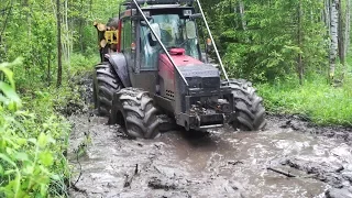 Valtra forestry tractor logging in summer forest