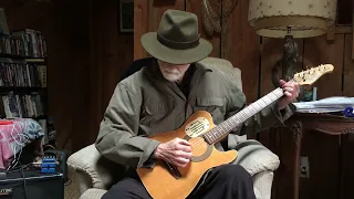 Ron Smith plays “16 Tons” on guitar