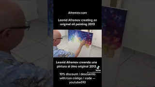 Artist leonid afremov creating an original oil painting on canvas using a palette knife in 2013