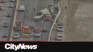 Stolen pickup crashes into tractor trailers on Hwy. 400, suspects allegedly carjacks 2nd vehicle to