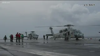 Search continues for the five crewmembers in Navy helicopter crash, 6 others injured are in stable c