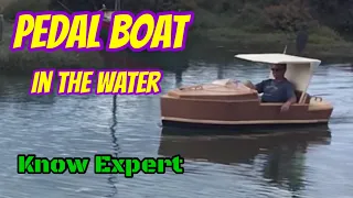 Pedal boat..... in the water at last. Small propeller driven 2 seater wooden boat.