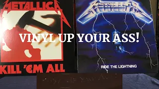 Vinyl up your ass: Walmart exclusive Metallica colored vinyl: Kill Em All and Ride the Lightning.