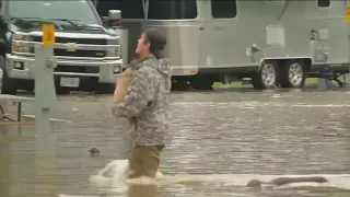 Tennessee man walks through flooding to rescue dog