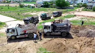 Many Dump Trucks 5T and Dozer Continue the project of filling land with stone and construction Trash