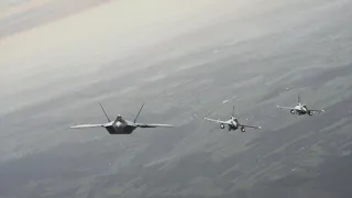 NATO releases footage of American F-22 fighter jets in formation with Italian Eurofighters and other