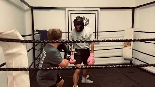 Sam Smart, helping the local kids spar at Secret Boxing