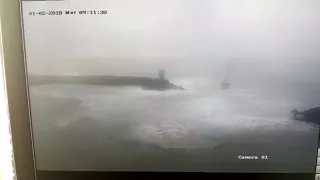 Catamaran trying to exit Porto di Roma at foul weather. View from control tower.