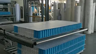 Fully automatic mattress stacking system