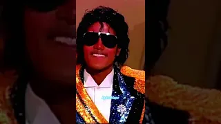 Michael Jackson takes his glasses off at the 1984 Grammys