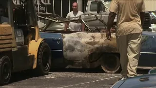 Tens of thousands of damage reported after fire erupts at classic car dealership