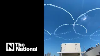 Japanese fighter jets draw Olympic rings over Tokyo