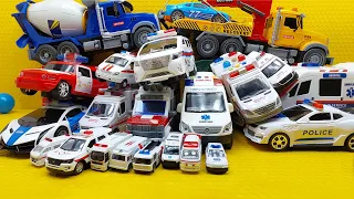 Collection of beautiful toy cars:ambulance,transforming police car,ambulance. police car,crane truck