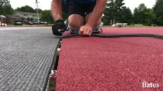 Installing a Mondo track surface at Bates