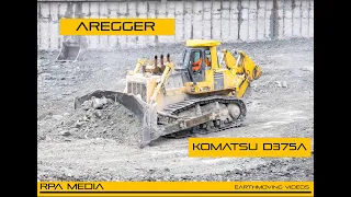 KOMATSU D375 pushing rock.