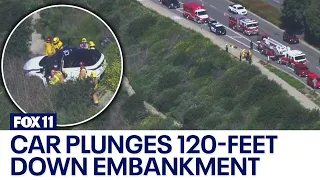 Car plunges down embankment in Newport Beach