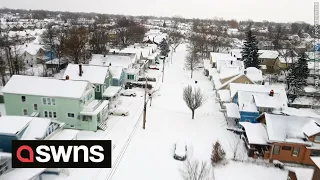 Drone footage shows Buffalo buried under snow after historic blizzard | SWNS