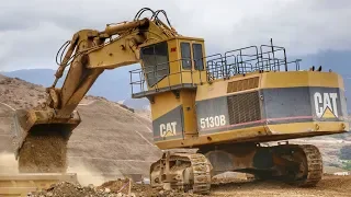 Caterpillar 5130B Excavator Loading Trucks