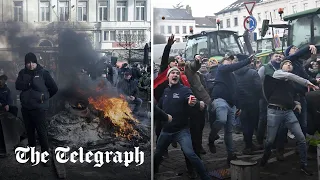 Police hose down egg-throwing farmers outside EU parliament in Brussels