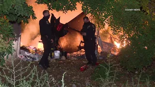Homeless Encampment Found Burning Along Freeway | Santa Ana, CA