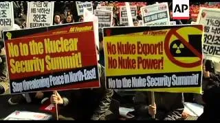 Thousands rally against nuclear summit, in support of defectors