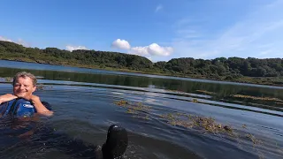 Entertaining first time floating with the buoyancy aids before sea kayak rescue practice, Scotland