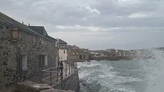 Waves crashing over lambeth walk St ives cornwall