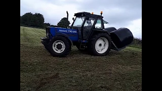 Big blue lifting double bales