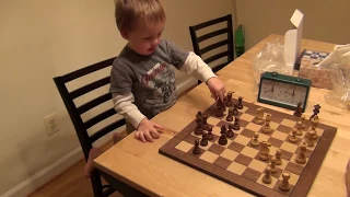 3 years old boy playing chess