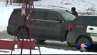Man in custody after woman's car stolen with her kids inside
