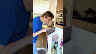 Dad is trying to close the fridge door...😱