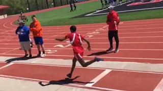 8th Grader does a flip in long jump and wins his division