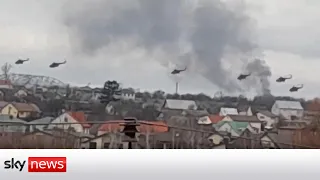 Russian helicopters circle Kyiv and tanks cross the Belarus border into Ukraine