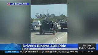 Woman drives on the 405 Freeway with three wheels and her trunk open