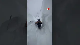 Snow towers over people in northern California