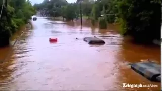 Submerged US Army truck drives through Irene flood waters