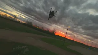 FPV Drone chasing a paramotor pilot